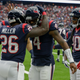 Deshaun Watson, No. 4 of the Houston Texans, celebrates with Lamar Miller, No. 26, and DeAndre Hopkins, No. 10, after a first-quarter score against the Tennessee Titans at NRG Stadium on Oct. 1, 2017, in Houston. (Bob Levey/Getty Images)